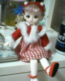 the previous pink haired doll, now shown her full body and her legs kicking up