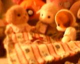sylvanian families figurines from the home page, the dog is tucking the younger 2 in for bed