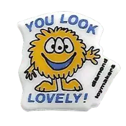 a yellow fuzzy monster with the caption you look lovely!